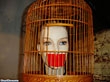 A mannequin with duct tape on her mouth – in a bird cage. We're not kidding.